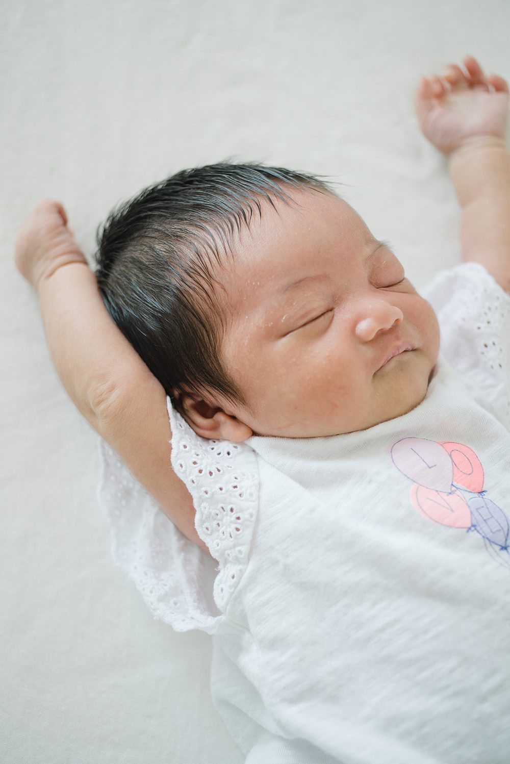 asian-newborn-stretching