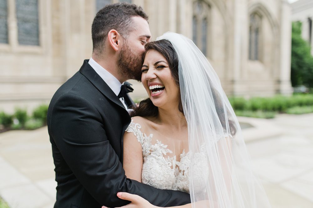 groom-kissing-laughing-bride